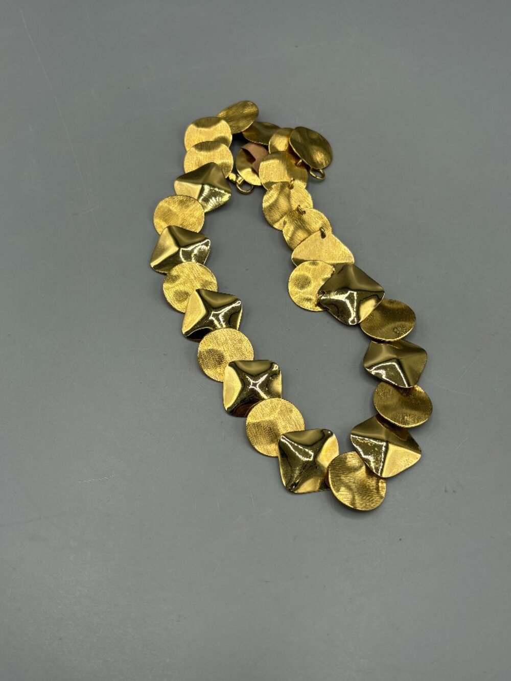 Gold tone disc necklace